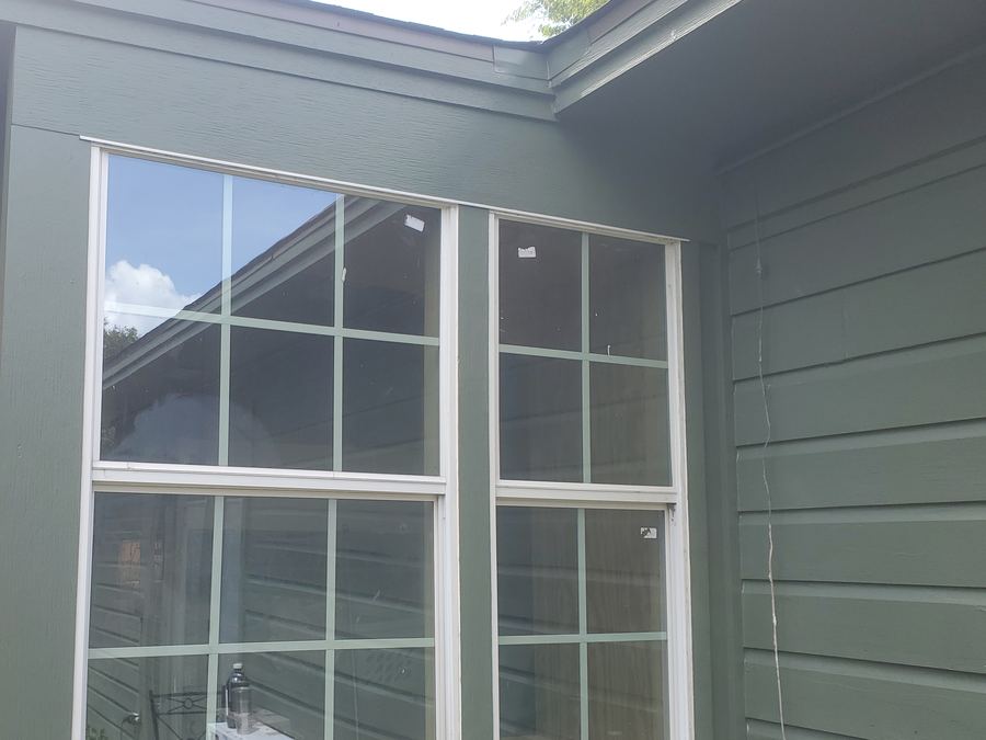 Exterior with new siding and windows