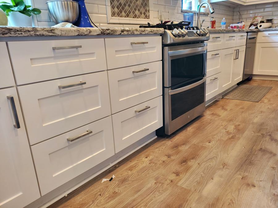 Remodeled kitchen with white cabinets